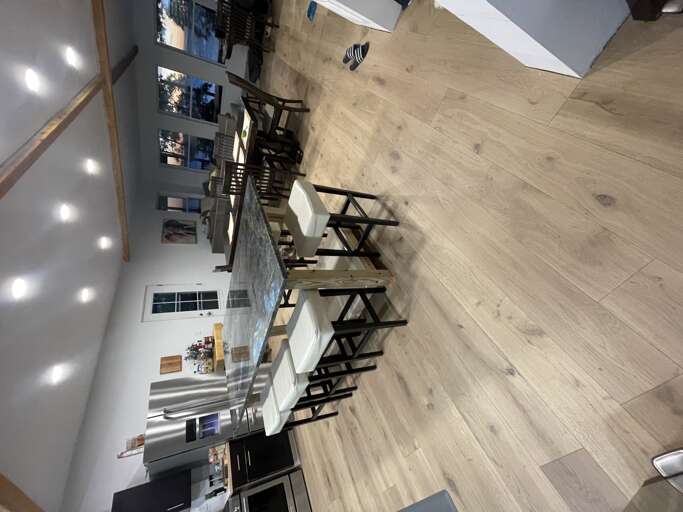 Kitchen Island, Dining, and Living Area | Angola on the Lake Beach House